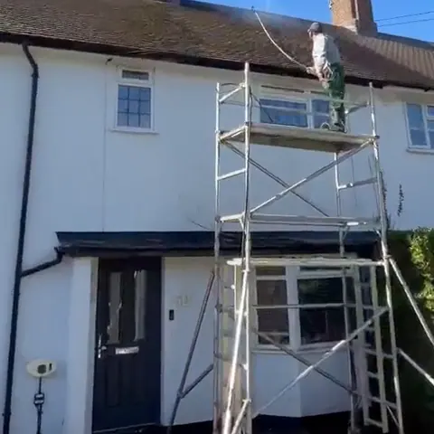 Roof cleaning in progress